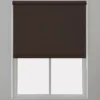 Brown roller blind installed on a window