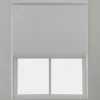 Light gray roller blind installed on a window