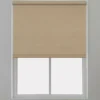 Beige roller blind installed on a white window