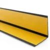 Black PVC angle trim, reverse side with the self-adhesive tape Reverse side of the Black PVC wall corner protector trim showing the adhesive tape