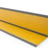 Dark Gray PVC angle trim, reverse side with the self-adhesive tape Reverse side of the Dark Gray PVC wall corner protector trim showing the adhesive tape