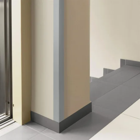 Dark Gray PVC Corner Protector on a Wall Pillar, 1m Angle Trim Dark Gray PVC wall corner protector trim installed on a wall pillar, elevator lobby