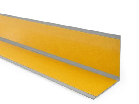 Gray PVC angle trim, reverse side with the self-adhesive tape Reverse side of the Gray PVC wall corner protector trim showing the adhesive tape