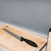 Self-adhesive PVC skirting board trim fitted in a room setting